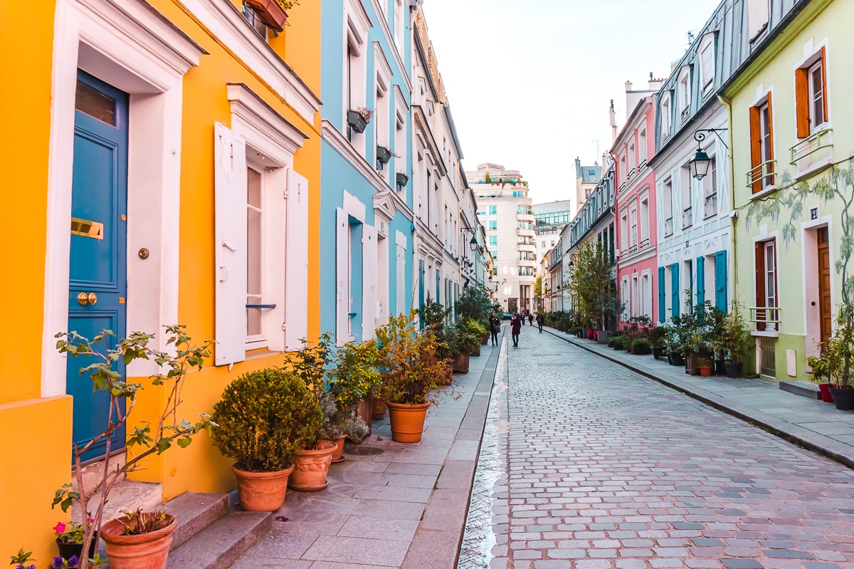Colourful houses in Paris (one of the best places to travel alone in Europe).