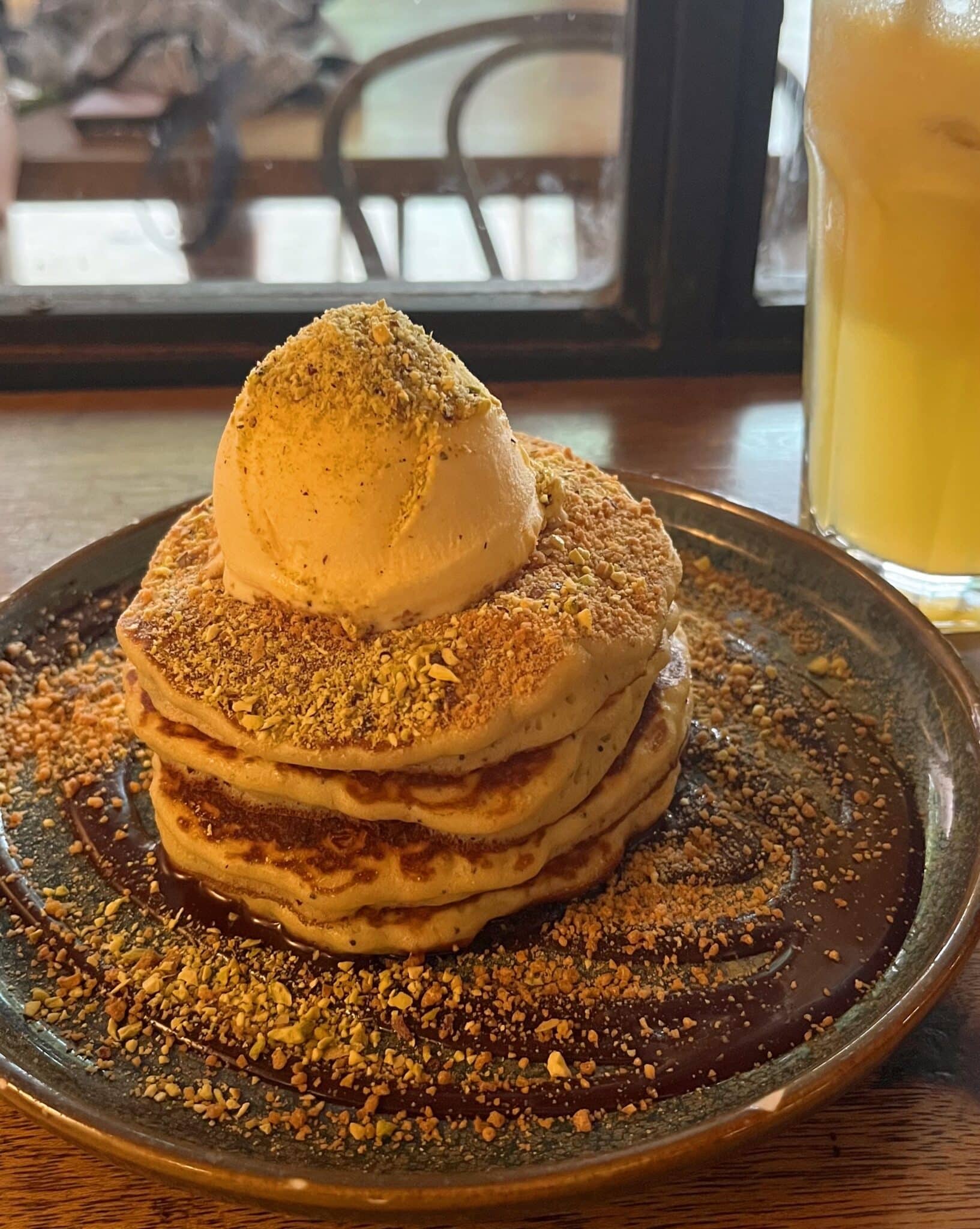 Stack of pancakes with a juice from Feeka Coffee Roasters in Kuala Lumpur, Malaysia